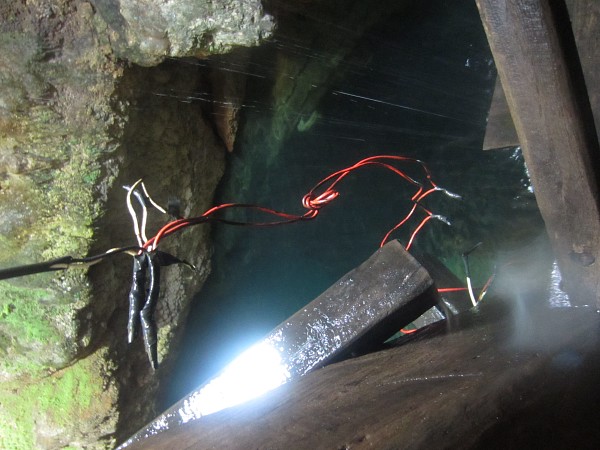 Random LIVE electric wires in a dripping wet cave